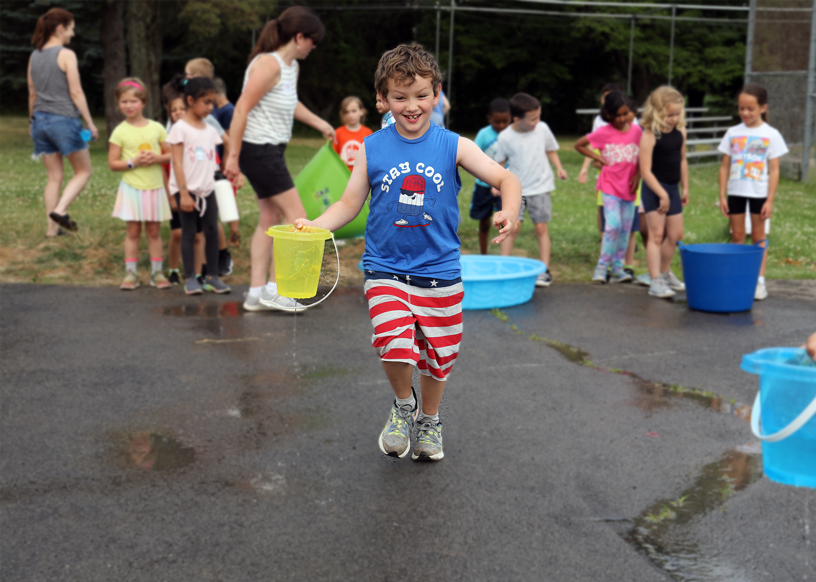 field day race with a bucket of water