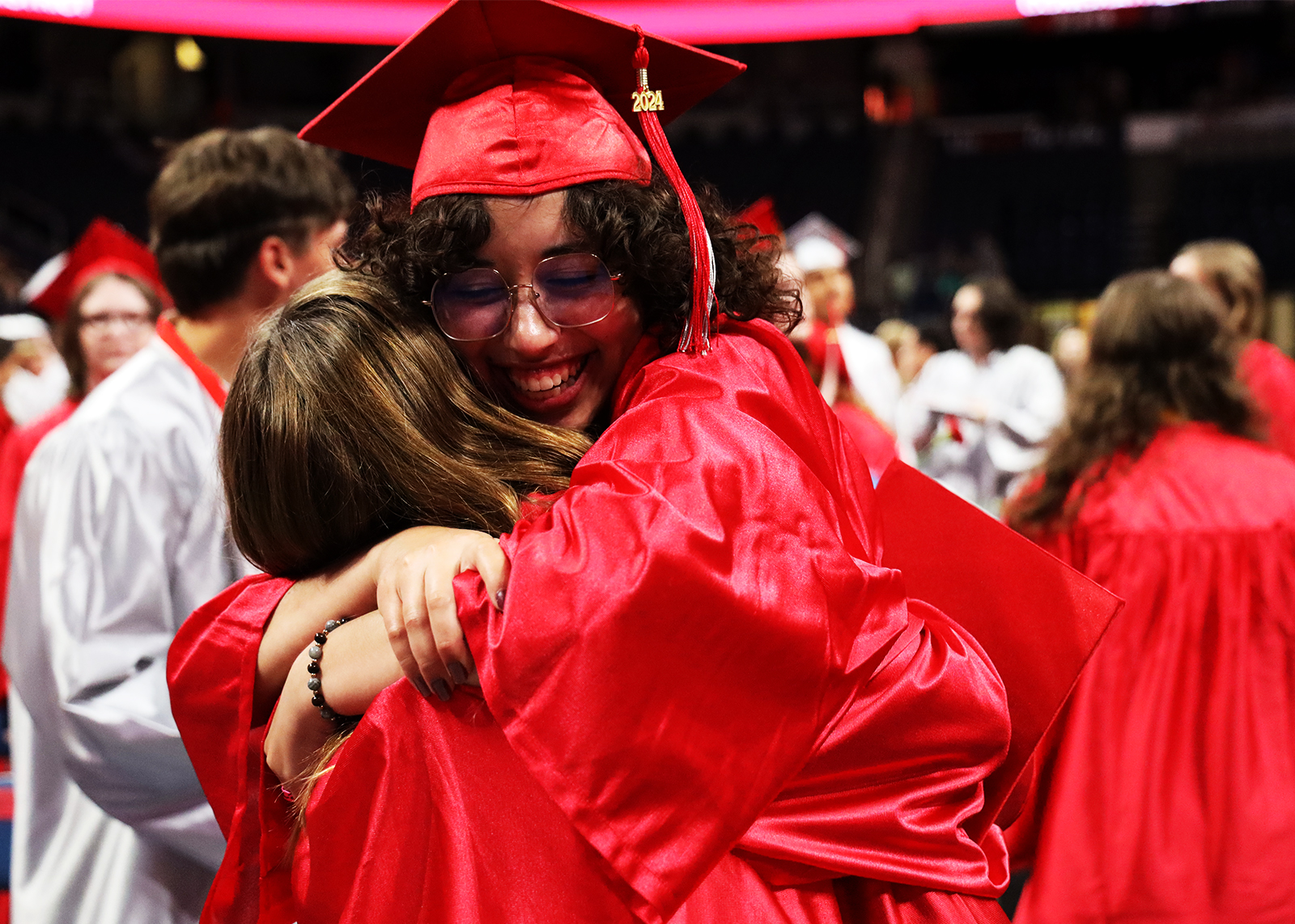 happy graduates hugging