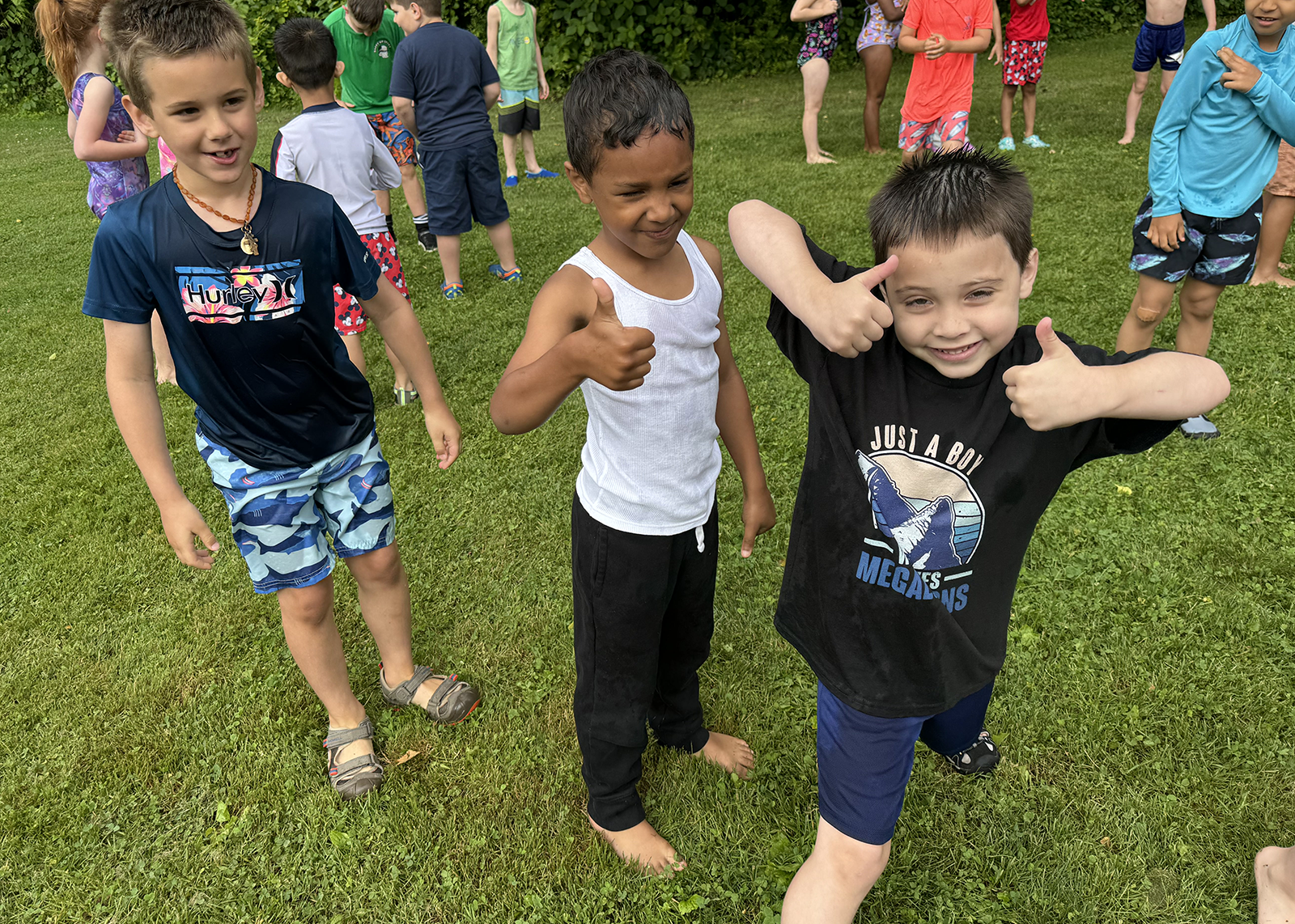 elementary students giving thumbs up at field day