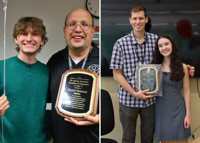 students with teachers and plaques