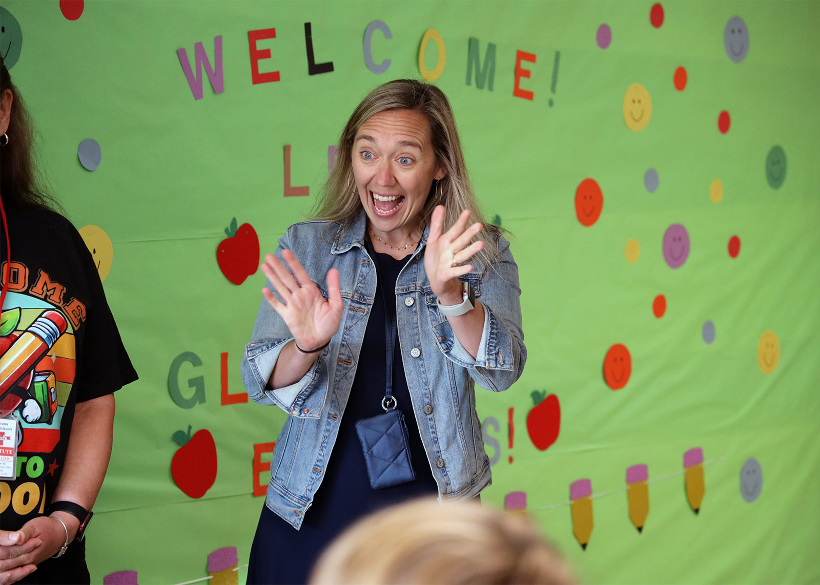 teaching waving and smiling at entering students