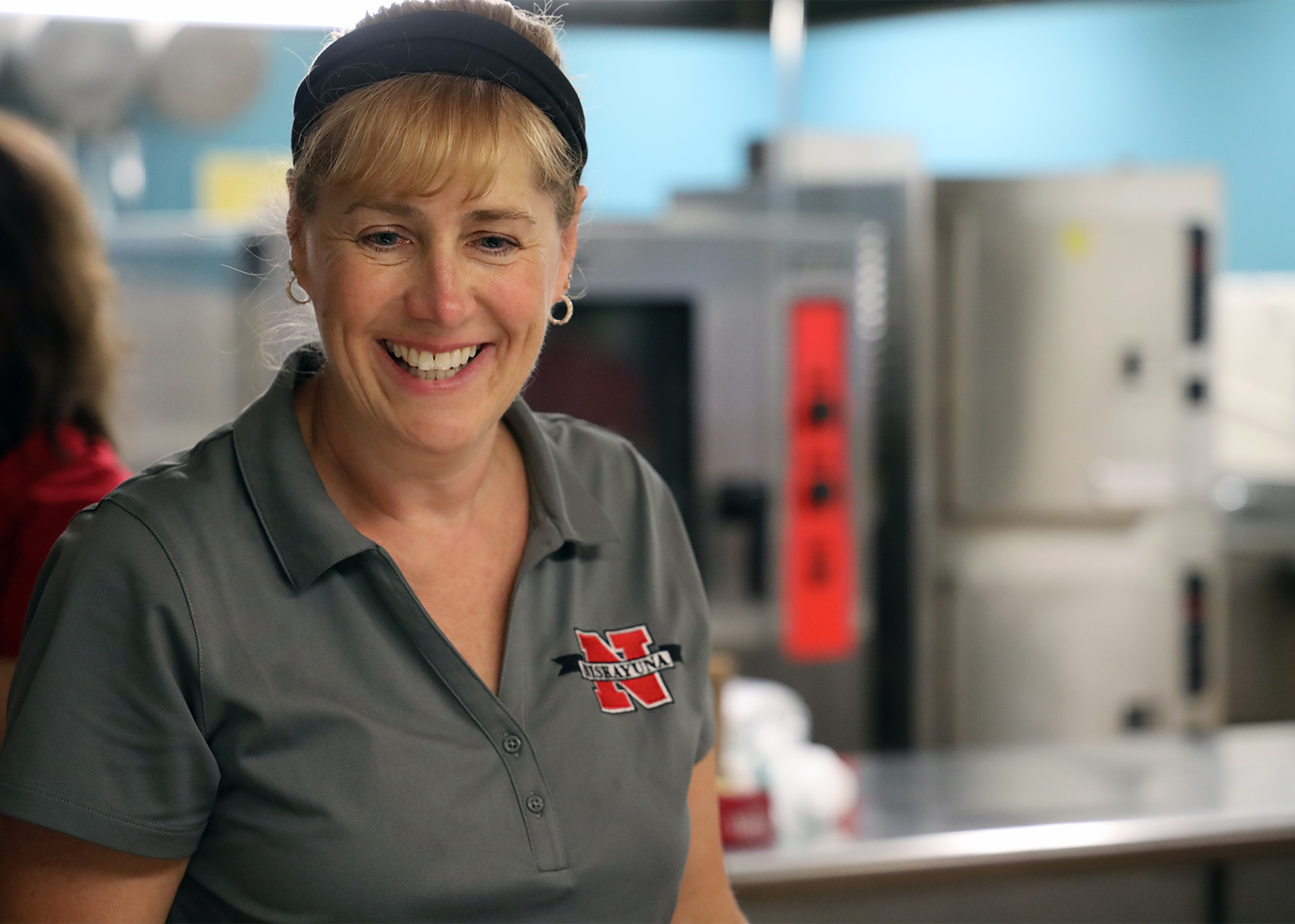 smiling cafeteria worker