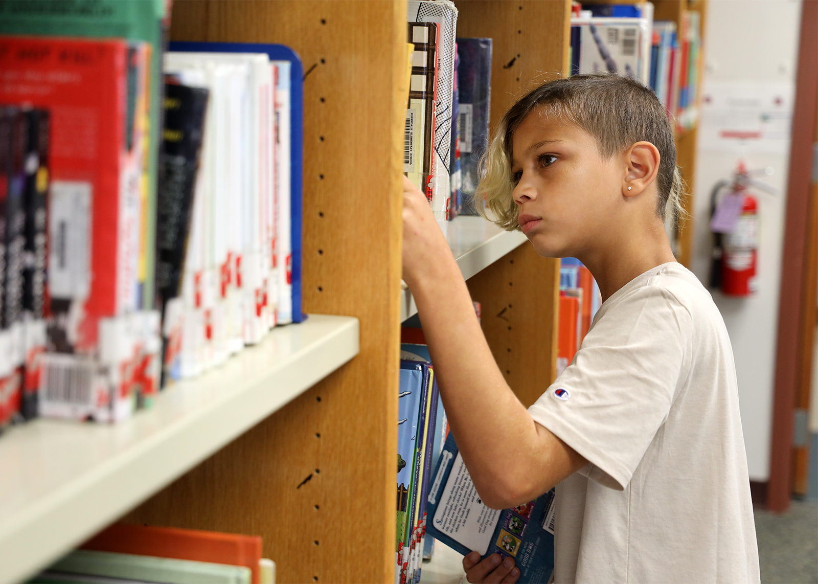 student picking out a book