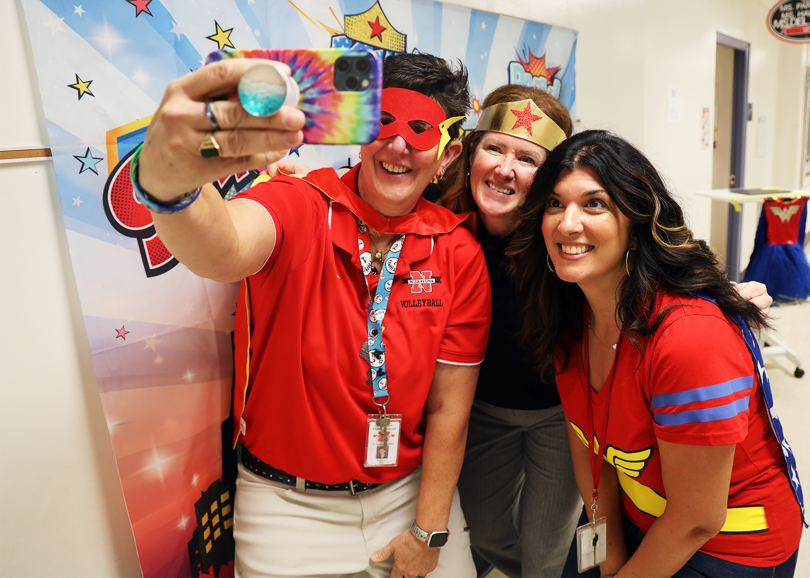 school staff take selfies as super heroes