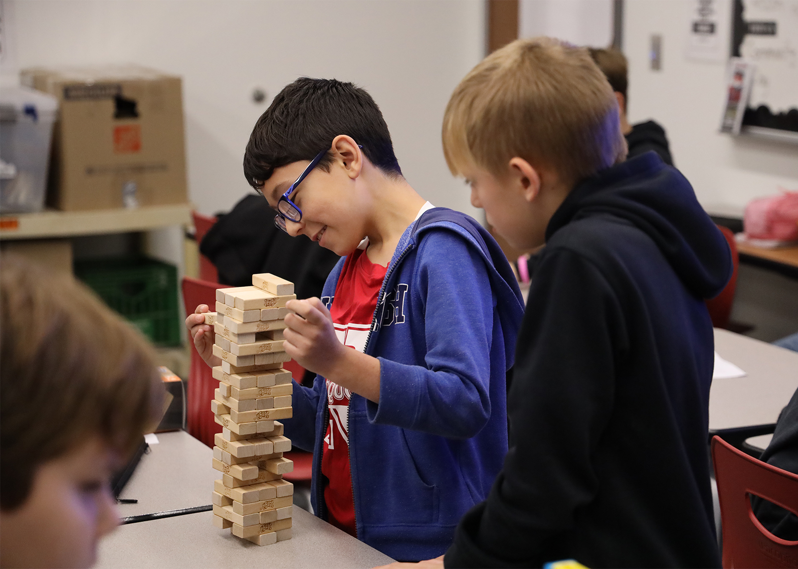 middle school students playing jenga