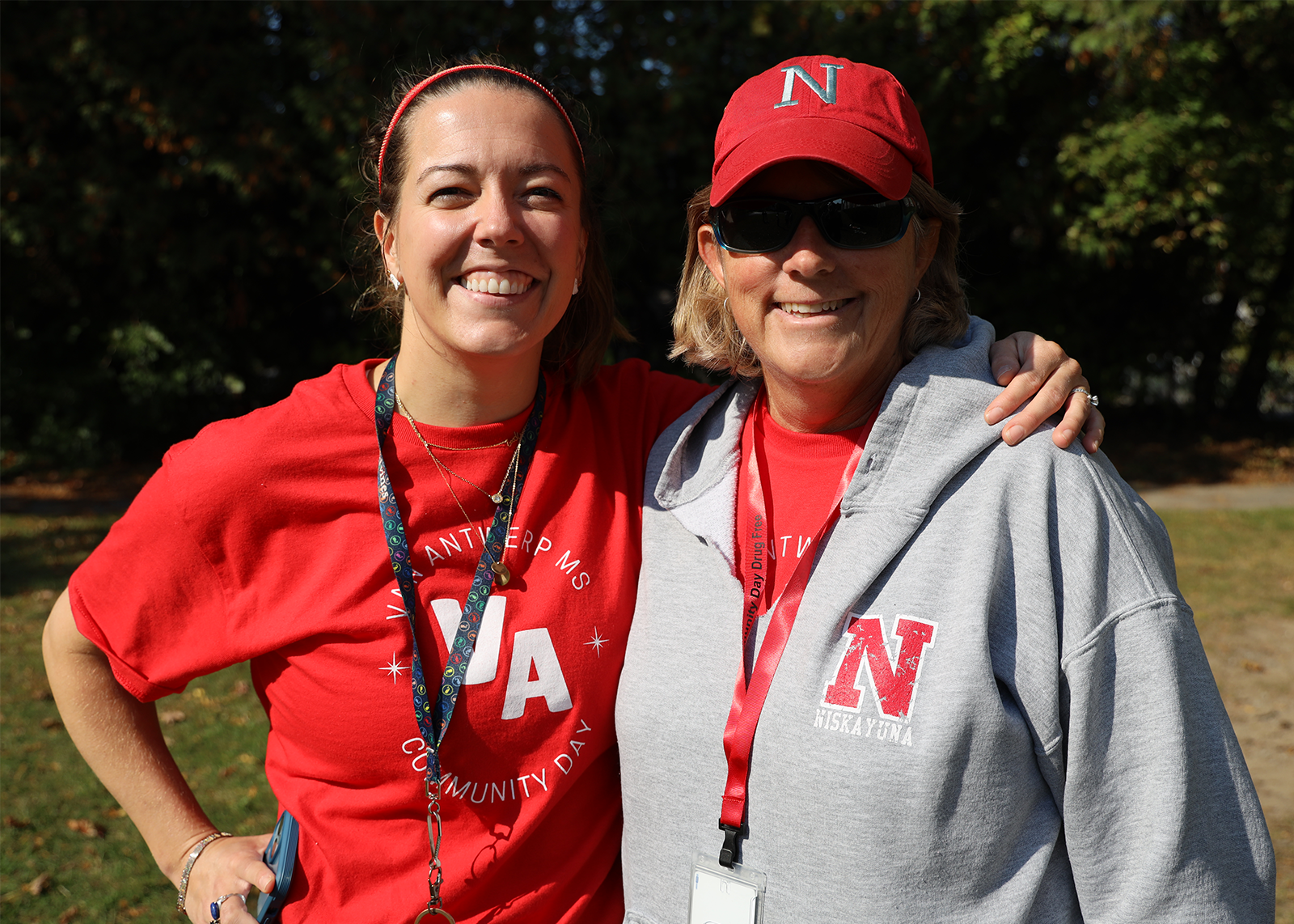 two educators smiling