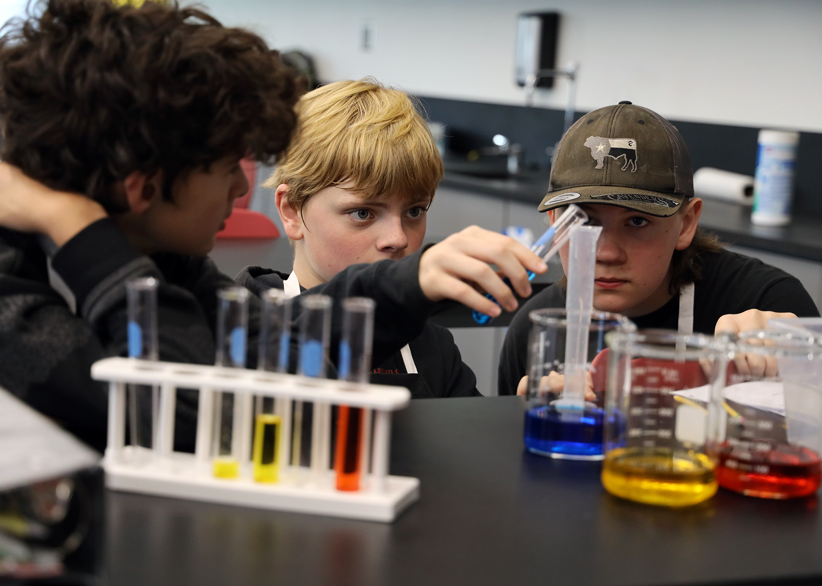 students using test tubes and beakers