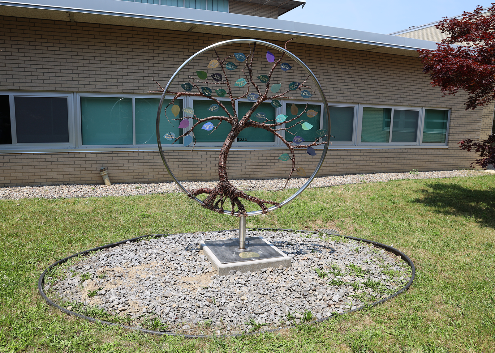 iron tree sculpture in courtyard