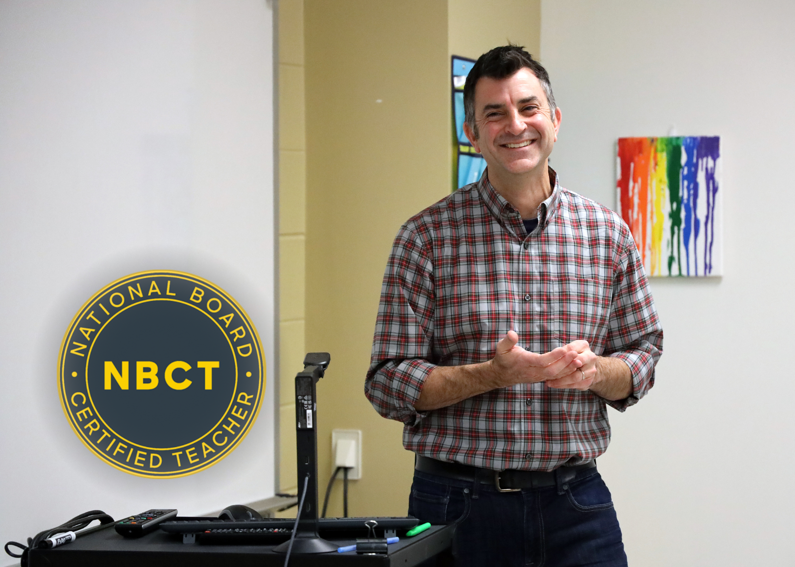 English teacher smiling with crest that reading national board certified teacher