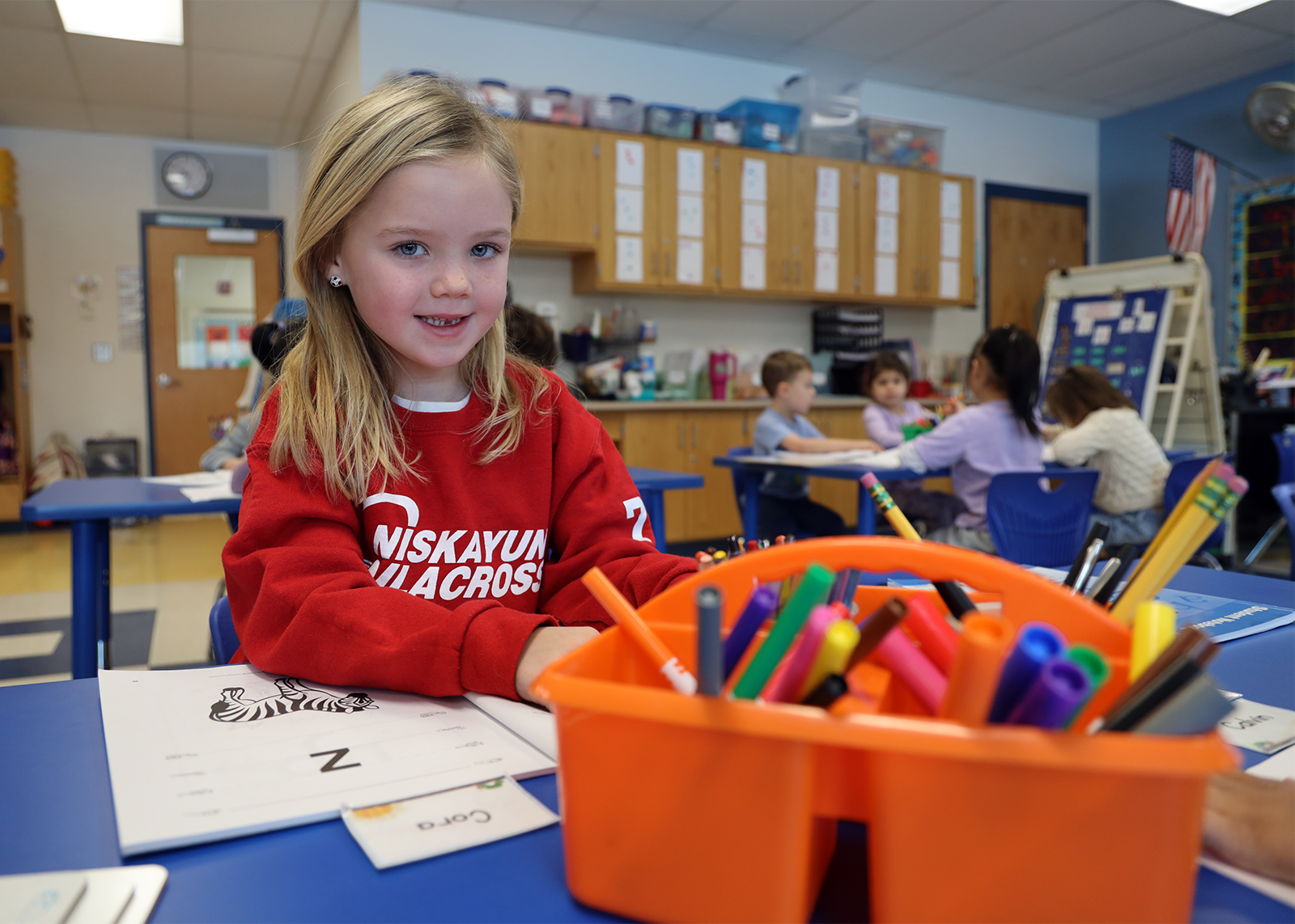 kindergartner smiles at camera