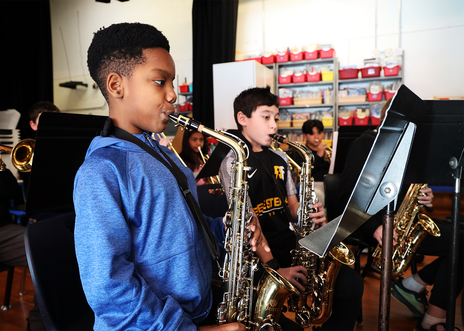 elementary kids play saxophone