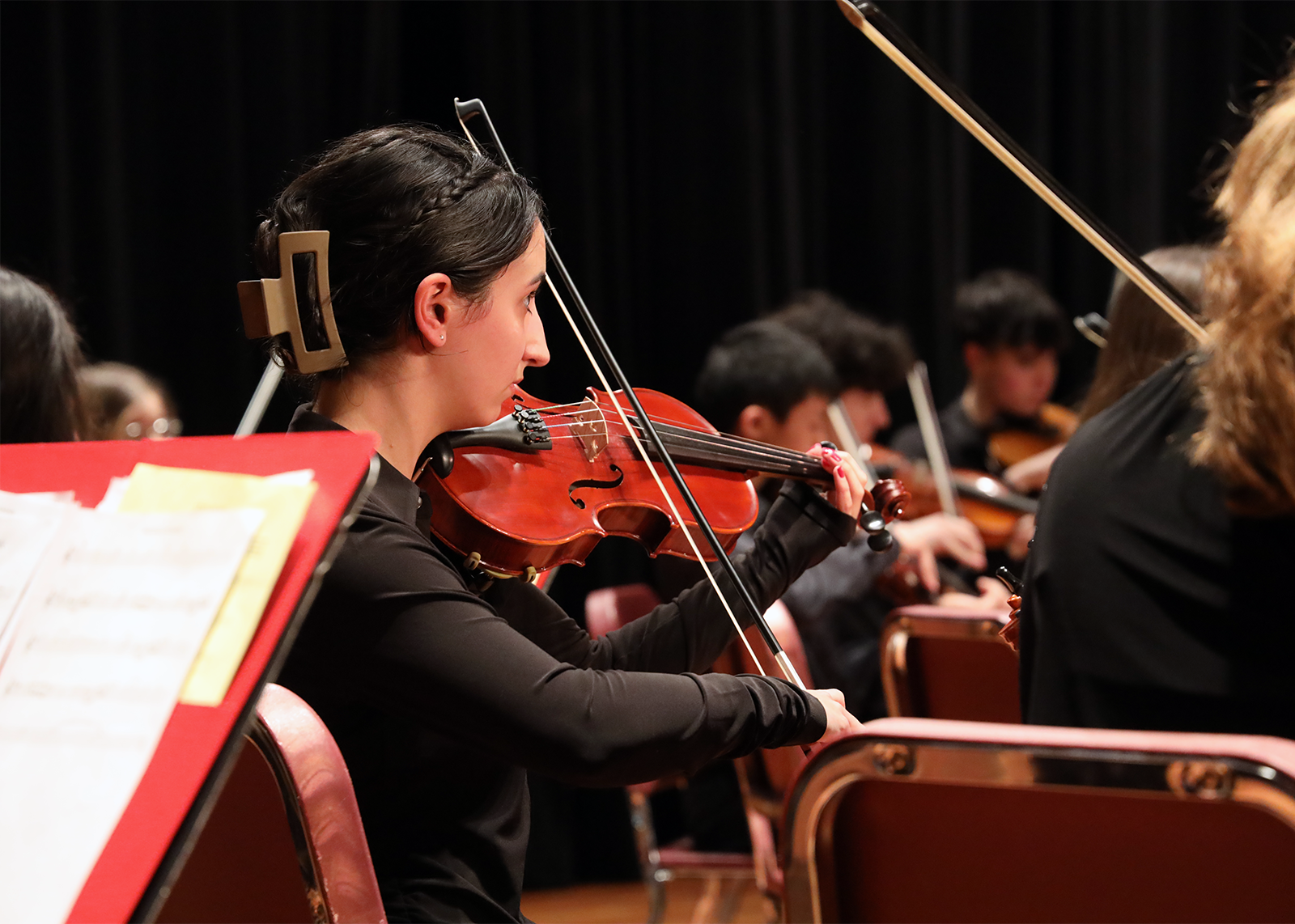 student playing string instrument