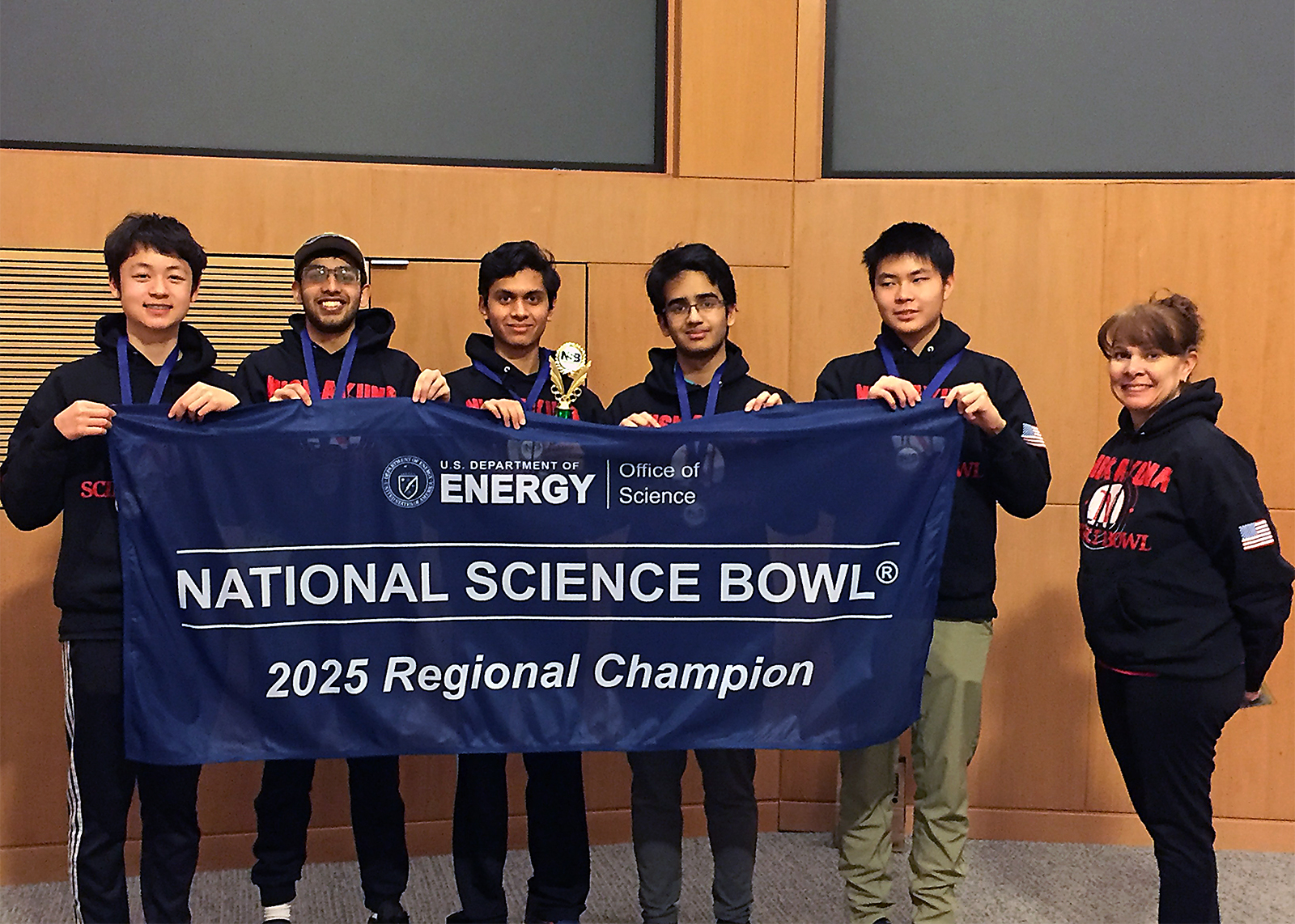 high school science bowl team with banner that says national science bowl regional champions