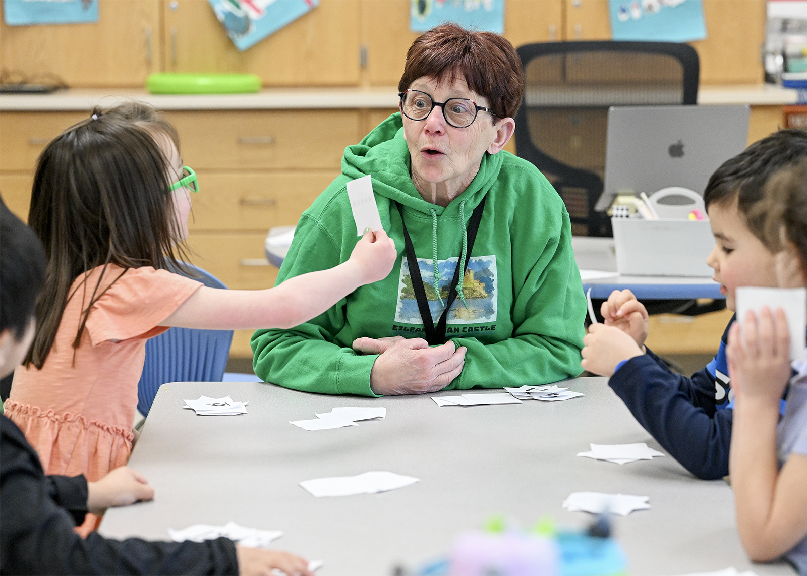 teacher big shocked face to student with flash card