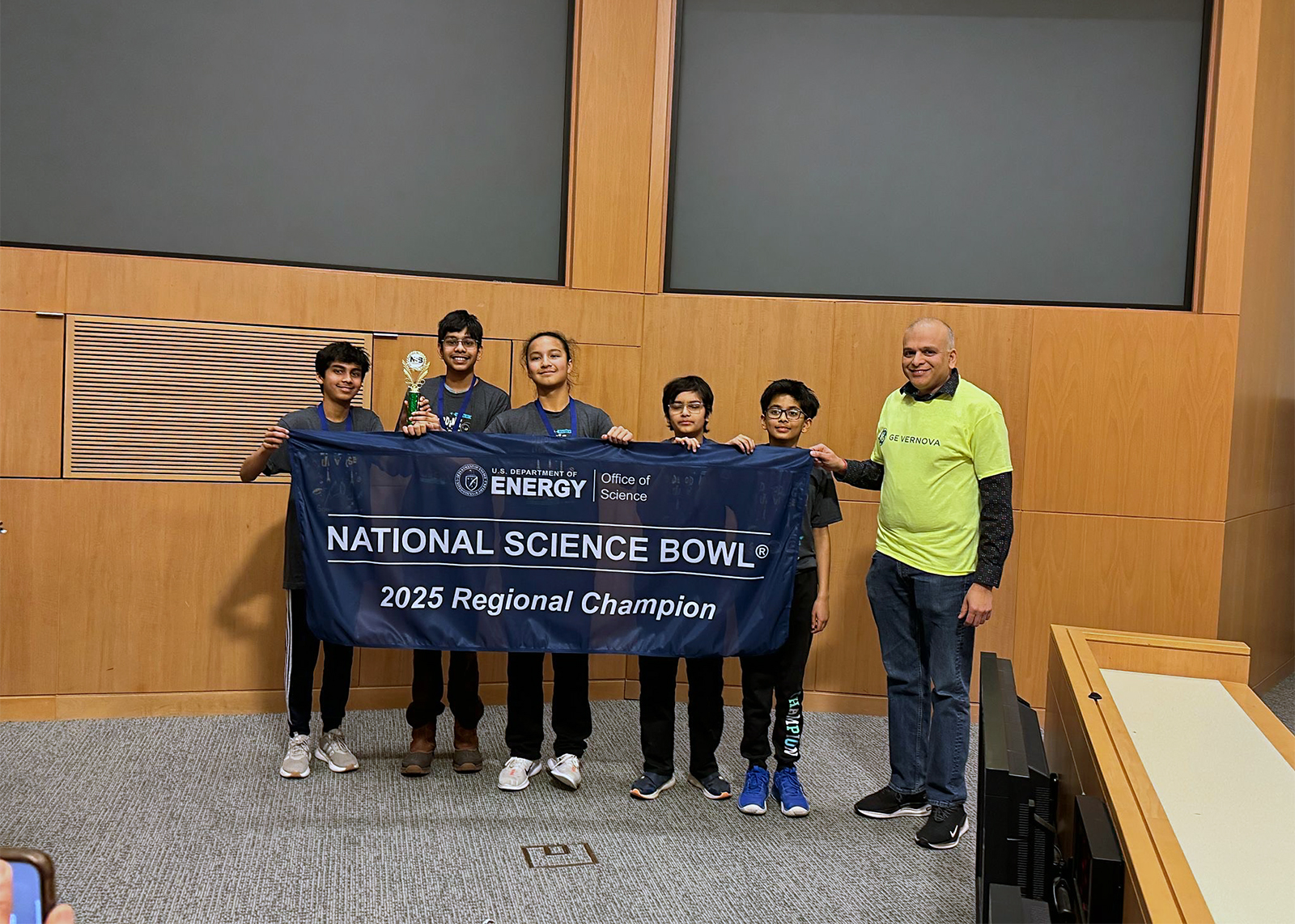 middle school students hold banner that says national science bowl 2025 regional champs