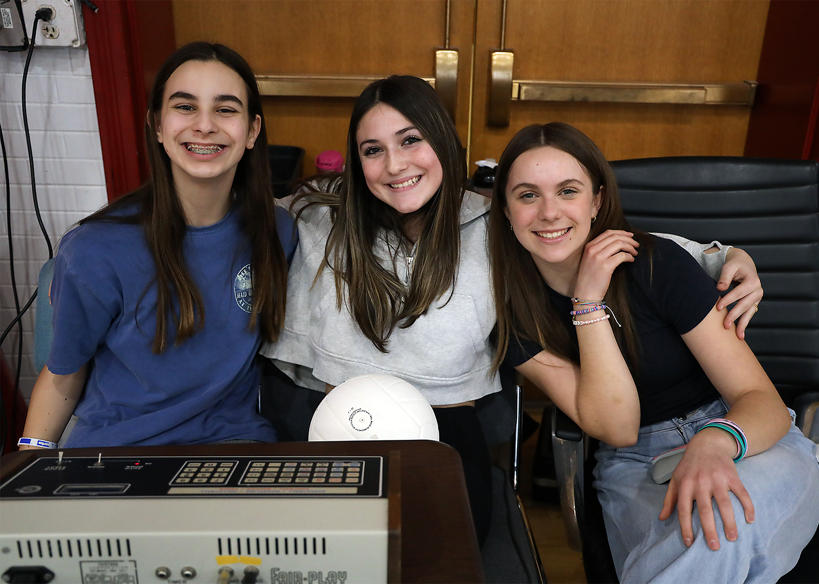 three middle schoolers at score table